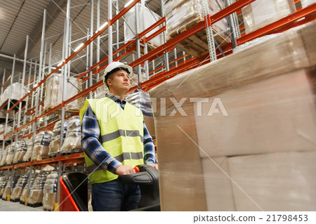 man on forklift loading cargo at warehouse man on forklift loading cargo at warehouse 21798453