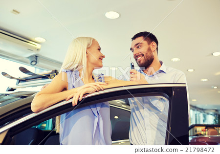 happy couple buying car in auto show or salon happy couple buying car in auto show or salon 21798472
