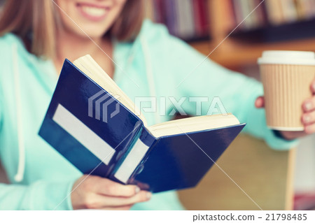 close up of student reading book at school close up of student reading book at school 21798485
