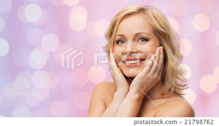 smiling woman with bare shoulders touching face smiling woman with bare shoulders touching face 21798762