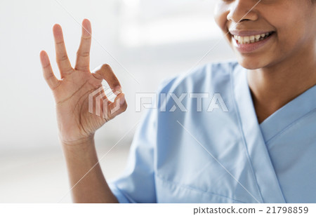 close up of african medic or nurse showing ok sign 21798859