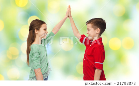 happy boy and girl making high five 21798878