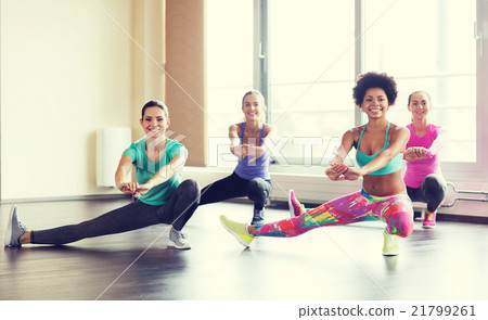 group of happy women working out in gym 21799261