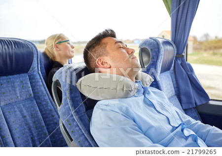 man sleeping in travel bus with cervical pillow man sleeping in travel bus with cervical pillow 21799265