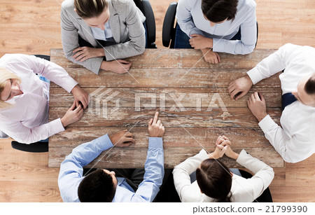 close up of business team sitting at table 21799390