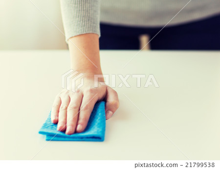 close up of woman cleaning table with cloth close up of woman cleaning table with cloth 21799538