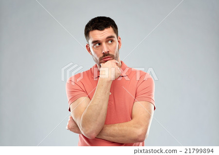 man thinking over gray background man thinking over gray background 21799894