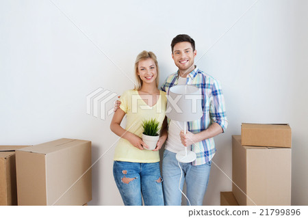 happy couple with stuff moving to new home happy couple with stuff moving to new home 21799896
