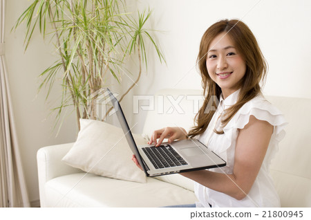 Women dealing with laptop computers in the room 21800945
