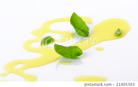 Olive oil drizzle and basil leaves 21805383