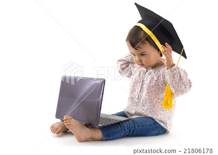 girl with graduation hat on a laptop girl with graduation hat on a laptop 21806178