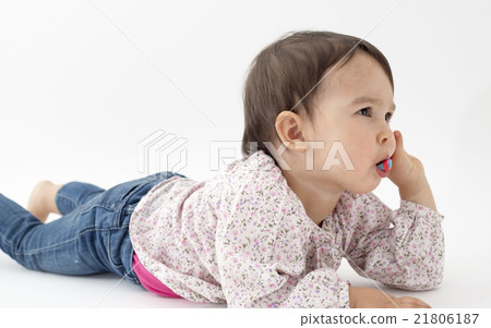 baby girl cleans teeth on white background baby girl cleans teeth on white background 21806187