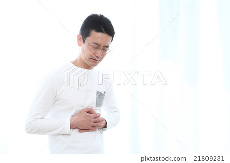 Midweight man in his 40s stomach pain Midweight man in his 40s stomach pain 21809281