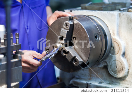 Milling machine operator work in factory workshop Milling machine operator work in factory workshop 21811834