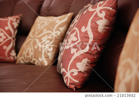 pillows on a leather sofa 21813682