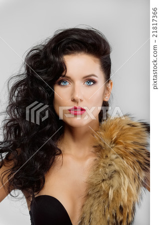 attractive brunette lady in corset with fur 21817366