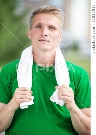 Tired man after fitness time and exercising. With 21825013