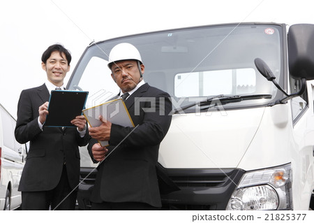 Two men in front of the track Two men in front of the track 21825377
