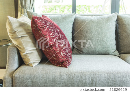 living room with row of pillows on sofa at home living room with row of pillows on sofa at home 21826629