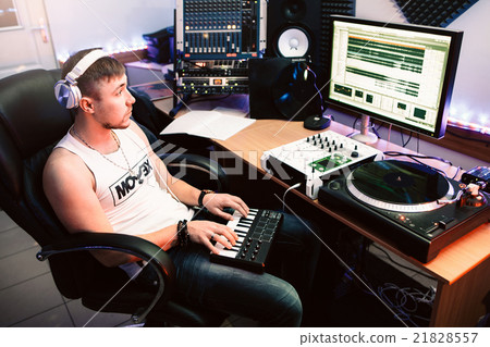 DJ playing piano in the recording studio DJ playing piano in the recording studio 21828557