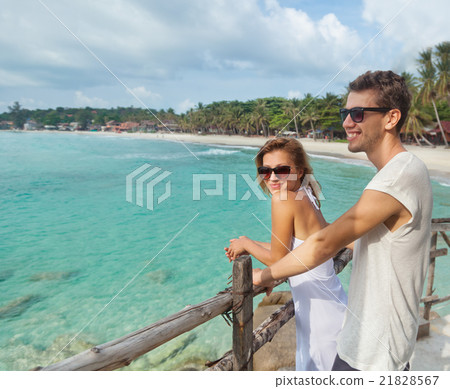 young couple looking at the sea. young couple looking at the sea. 21828567