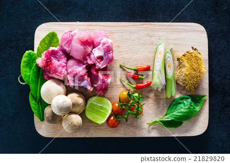 Raw pork ribs and organic thai herbs. 21829820