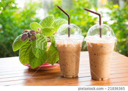 Iced coffee with straw 21836365