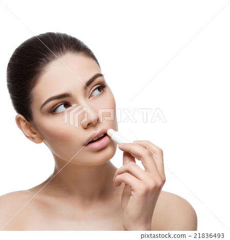 Beautiful girl applying chapstick Beautiful girl applying chapstick 21836493