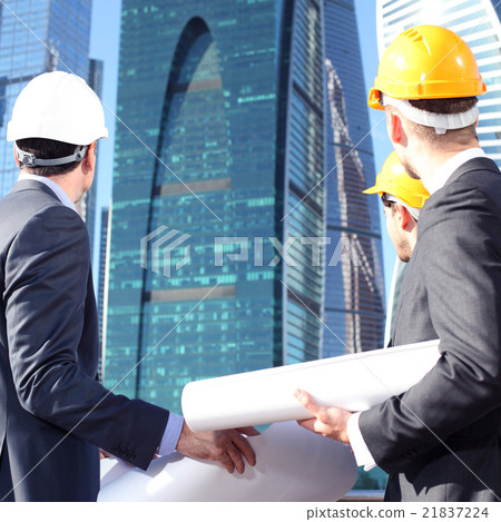 Architects with blueprint 21837224