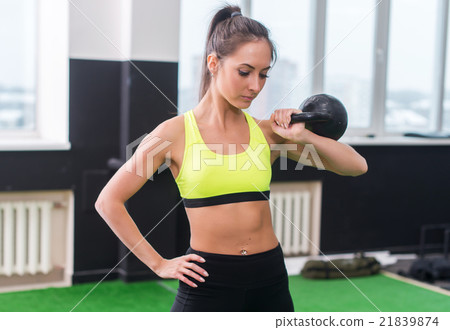 portrait of a young woman doing dumbbell lifting portrait of a young woman doing dumbbell lifting 21839874