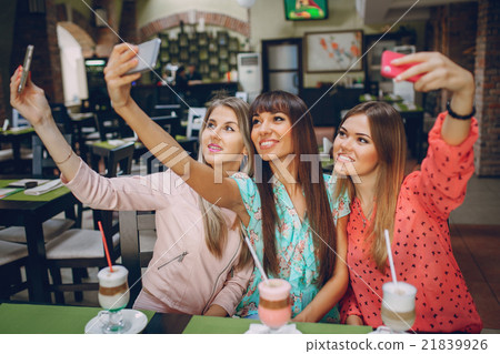 Girls with phones 21839926