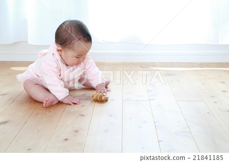 0 year old girl playing with toys 21841185