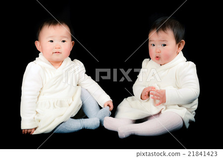Cute twin baby, black background Cute twin baby, black background 21841423