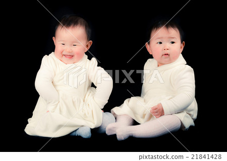 Cute twin baby, black background 21841428
