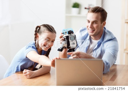 Positive father playing with his daughter  21841754