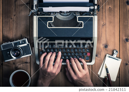 Typewriters and old cameras, coffee and notepad Typewriters and old cameras, coffee and notepad 21842311