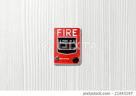 Fire alarm switch on white wood background Fire alarm switch on white wood background 21843297