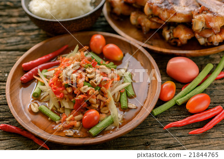 Famous Thai food, papaya salad and grilled chicken Famous Thai food, papaya salad and grilled chicken 21844765