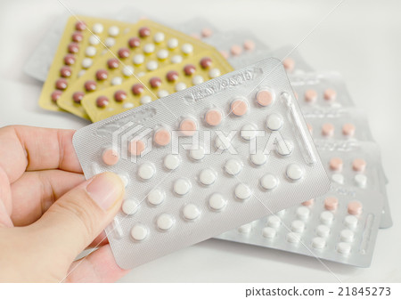 woman hand holding contraceptive pills woman hand holding contraceptive pills 21845273