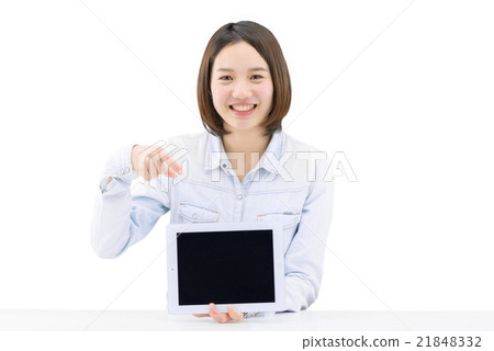 A young lady pointing to the screen of the tablet A young lady pointing to the screen of the tablet 21848332