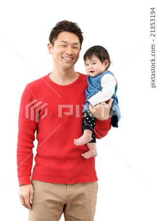 A young dad holding a baby A young dad holding a baby 21853194