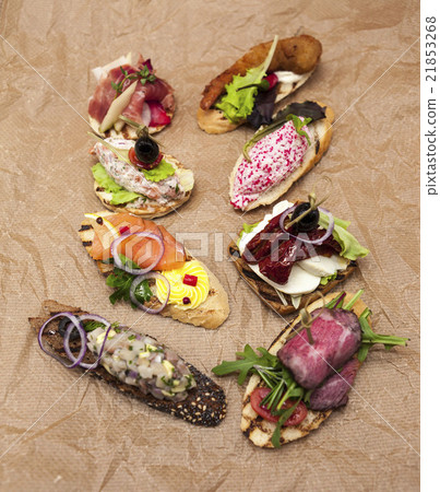 Set of Spanish tapas on the textiles background 21853268