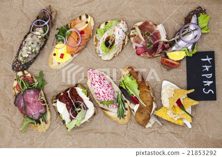 Set of Spanish tapas on the textiles background Set of Spanish tapas on the textiles background 21853292