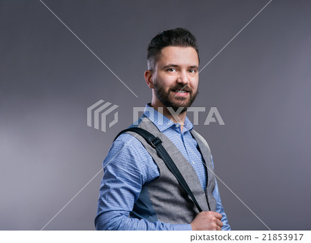 Hipster businessman in blue shirt, studio shot Hipster businessman in blue shirt, studio shot 21853917