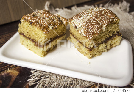 Sliced biscuit cakes from nuts and sesame seeds 21854584