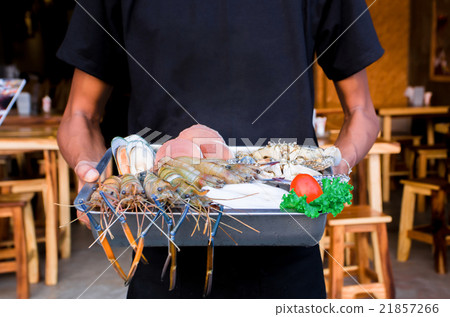 close up of man displaying fresh sedfood close up of man displaying fresh sedfood 21857266