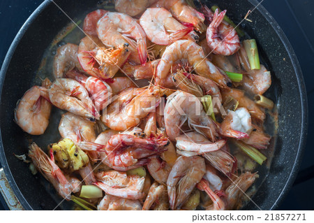 Baked Shrimps on pan with fresh herbs, view top Baked Shrimps on pan with fresh herbs, view top 21857271