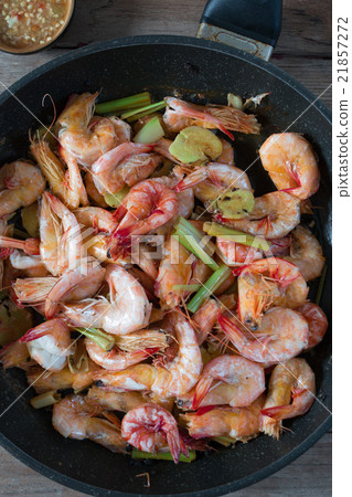 Baked Shrimps on pan with fresh herbs, view top Baked Shrimps on pan with fresh herbs, view top 21857272