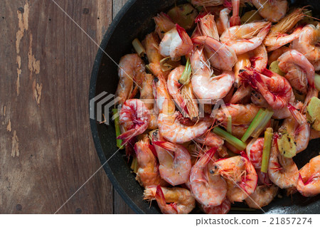 Baked Shrimps on pan with fresh herbs, view top Baked Shrimps on pan with fresh herbs, view top 21857274