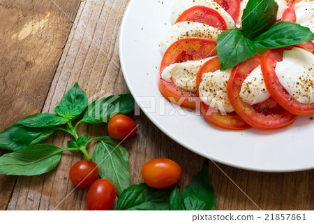 Caprese salad with mozzarella, tomato, basil Caprese salad with mozzarella, tomato, basil 21857861